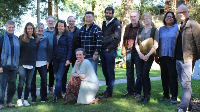 ecojustice board of directors stand together in a park.