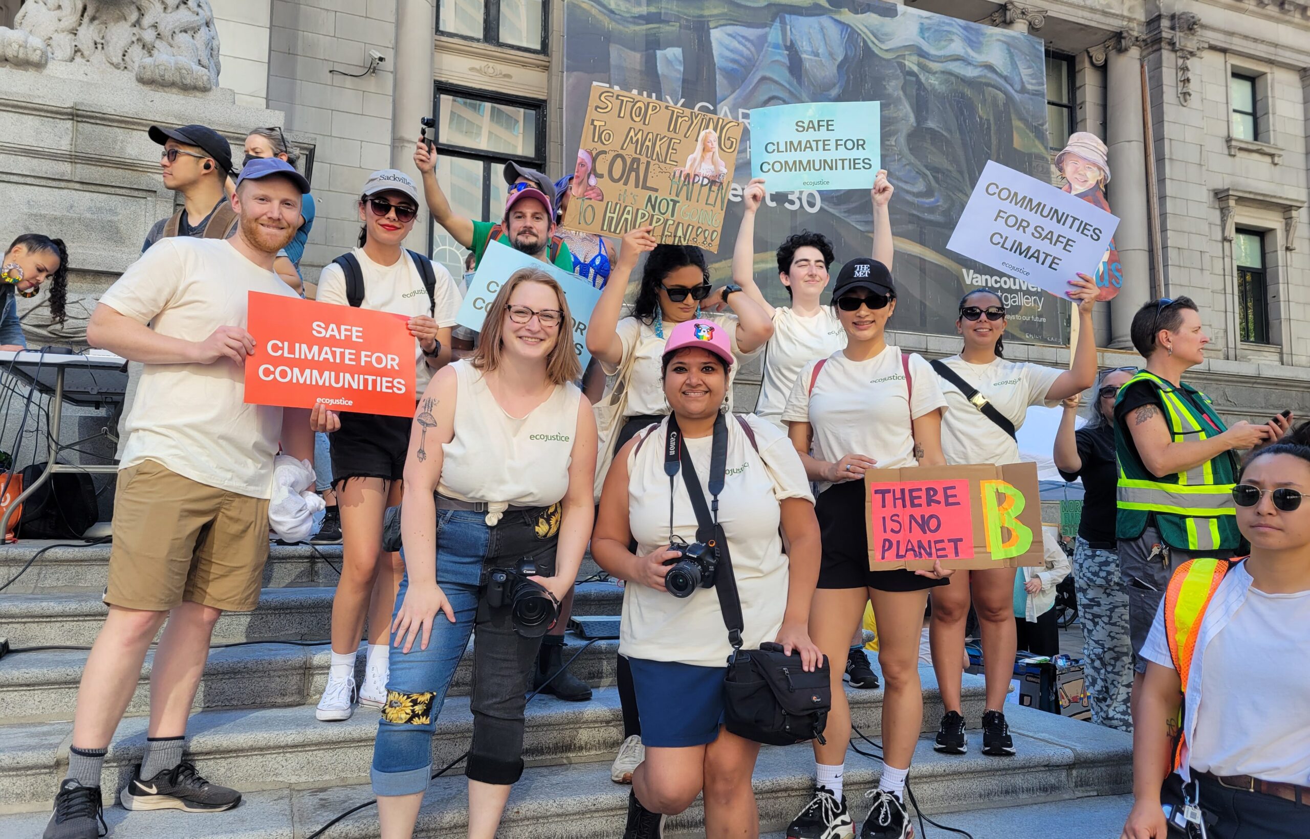 Team members of Ecojustice march for climate change outside of Vancouver Art Gallery.