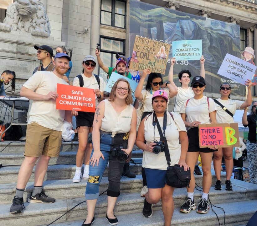 Team members of Ecojustice march for climate change outside of Vancouver Art Gallery.